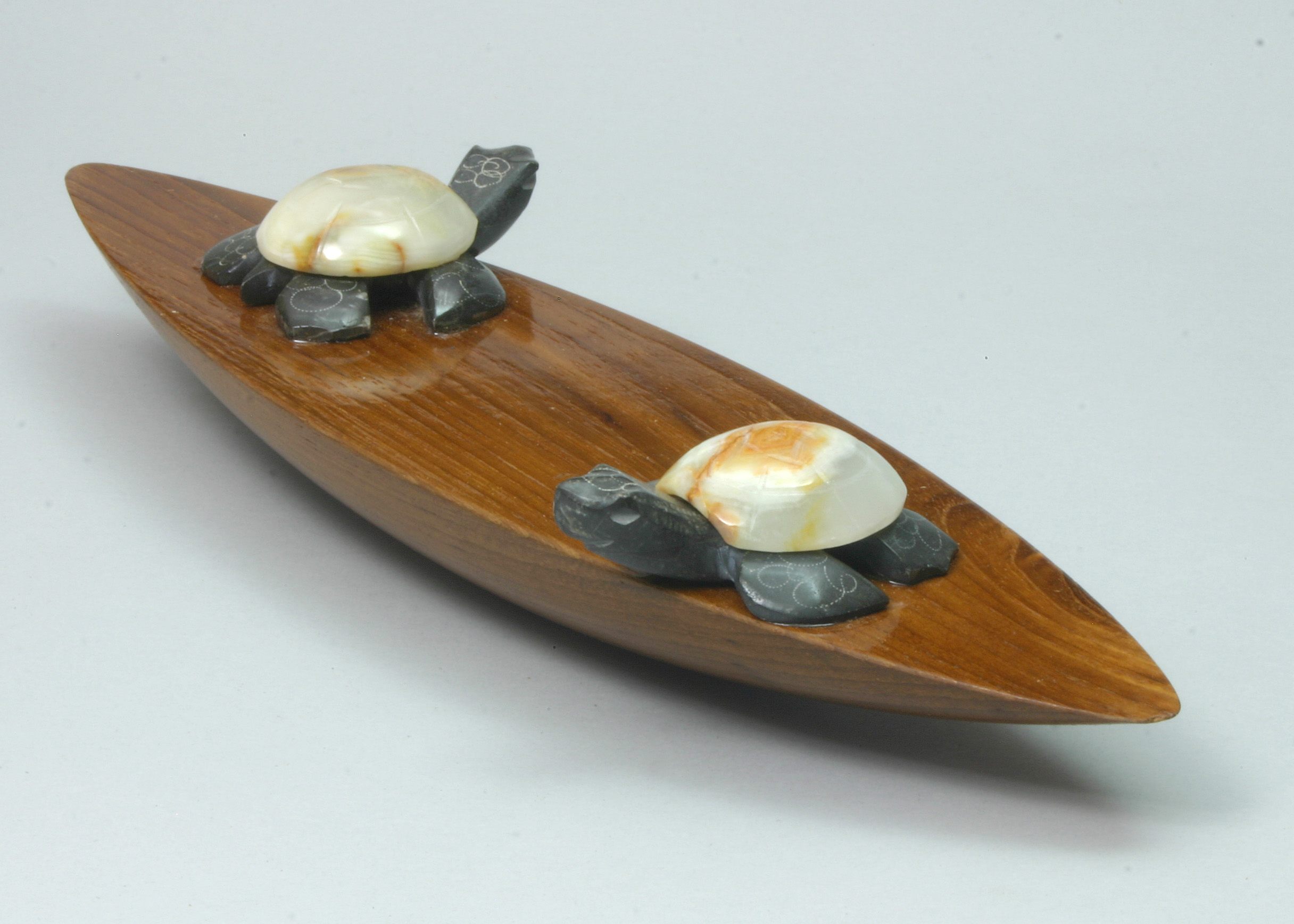 Rattleback with turtle weights